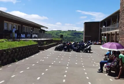 Learners gathered in the school yard overlooking the valley